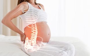 it hurts your back in pregnancy causes